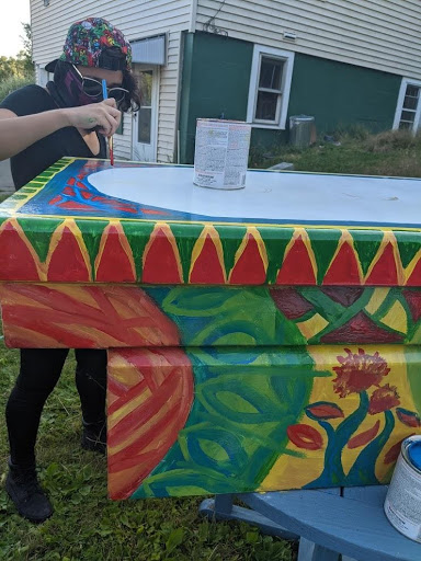 Painting a toolbox at More Gardens