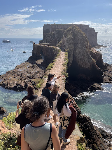 The ancient fortress and island became a classroom on an educational excursion! Students walk along the narrow path above the sea to the fortress.