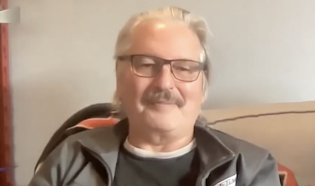 Bruce Sterling wearing glasses looking into the camera