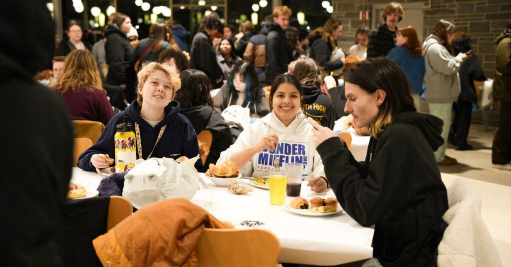 Three students eating