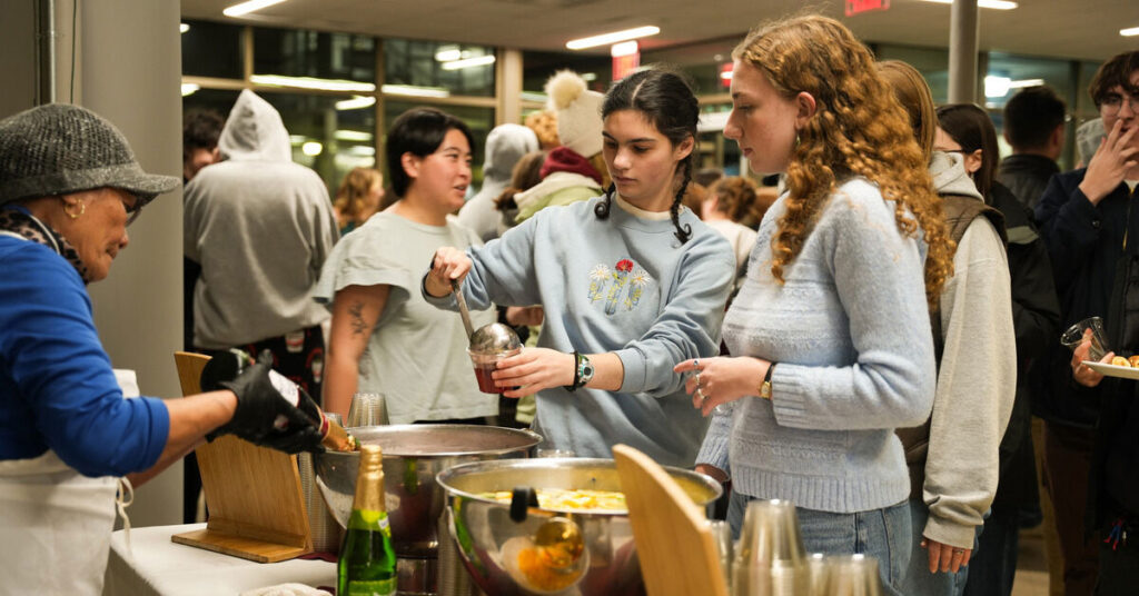 Two students getting fruit punch