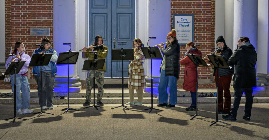 Students performing on their flutes