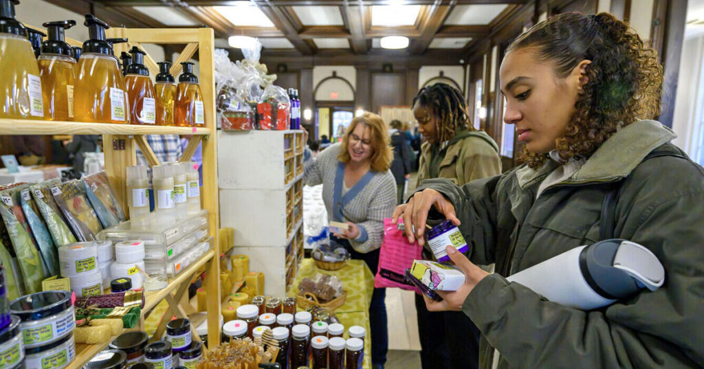 A student shopping at a craft fair